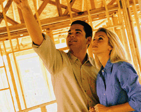 Image: Two people in a house under construction