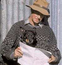 Farmer and kelpie reading questionnaire