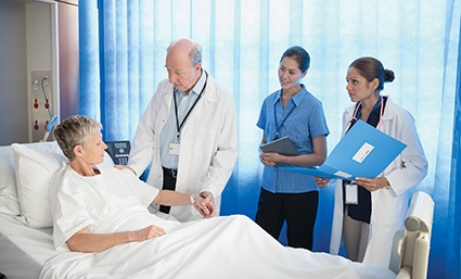 Photo of patient being cared for by hospital staff