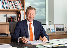 Image: of Australian Statistician David W Kalisch at a desk