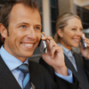 A man and a women talking on mobile phones