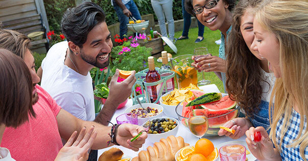 Friends laughing at a Barbeque lunch