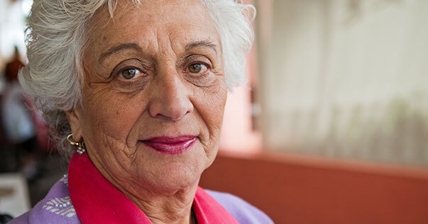 Older woman smiling into camera